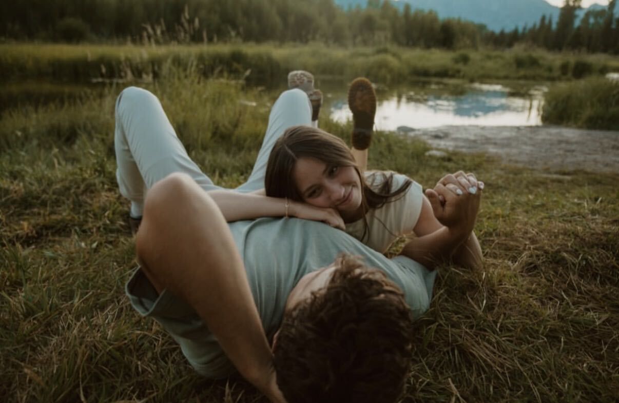 A happy couple relaxing outdoors